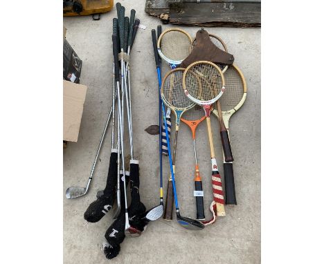 AN ASSORTMENT OF VINTAGE SPORTS EQUIPMENT TO INCLUDE GOLF CLUBS, BADMINTON RACKETS TO INCLUDE ONE WITH A PRESS ETC 