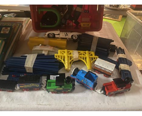 A QUANTITY OF TRAIN RELATED TOYS TO INCLUDE, PLASTIC TRACK, TOMY AND THOMAS THE TANK ENGINE TRAINS, ETC 