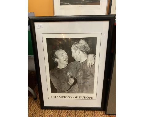 A LIMITED EDITION PRINT 54/500, CHAMPIONS OF EUROPE, FEATURING NOBBY STILES AND BOBBY CHARLTON AT WEMBLEY 1968 SIGNED BY NOBB