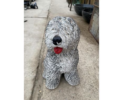 A HEAVY CERAMIC DOG FIGURE 