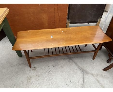 A RETRO 1970'S COFFEE TABLE WITH MAGAZINE UNDER SHELF 47 INCH X 16 INCH 