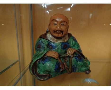 A TEA CADDY IN THE FORM OF A CHINA MAN, MARKED UNDERNEATH 