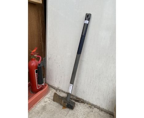 AN AXE/SLEDGE HAMMER 