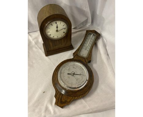 A WOODEN CASED BAROMETER TOGETHER WITH A WOODEN CASED MANTEL CLOCK 