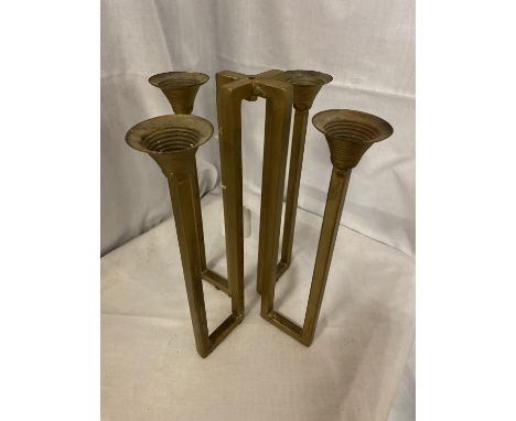 A BRASS GOTHIC STYLE FOUR BRANCH CANDLESTICK 