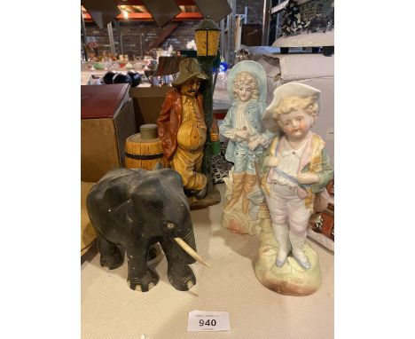A WOODEN ELEPHANT, TWO CERAMIC CONTINENTAL STYLE FIGURES , ETC 