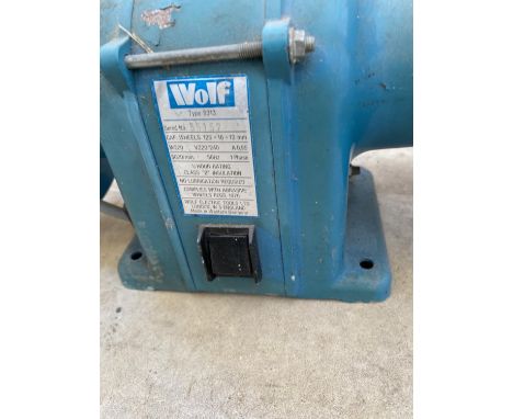 A WOLF ELECTRIC BENCH GRINDER IN WORKING ORDER BUT NO WARRANTY GIVEN 
