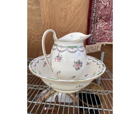 A CERAMIC FLORAL WASH BOWL AND JUG STAMPED 'CRESCENT' 