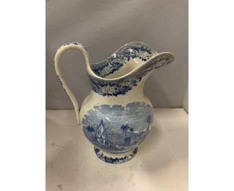 A VINTAGE BLUE AND WHITE JUG WITH TRANSFER PRINT 