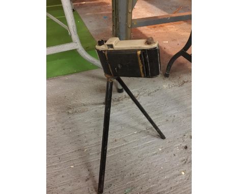 A VINTAGE KODAK CAMERA AND SMALL TRIPOD 