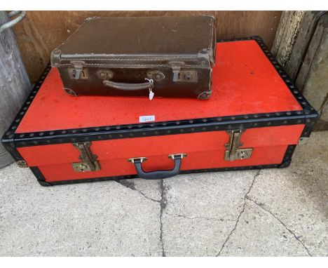 A LARGE VINTAGE RED TRAVEL CASE AND A FURTHER VINTAGE BRIEFCASE 