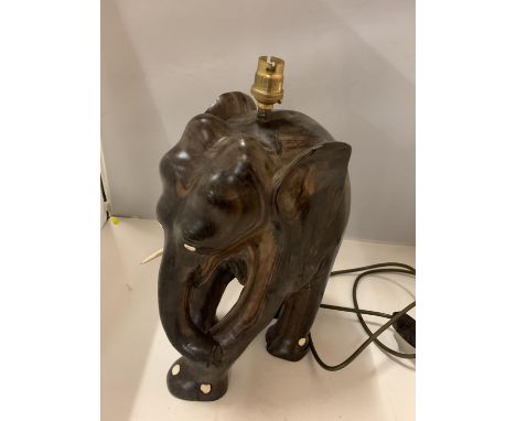 A HARDWOOD CARVED ELEPHANT TABLE LAMP WITH BONE DETAILING, ONE TUSK MISSING, HEIGHT 37CM 