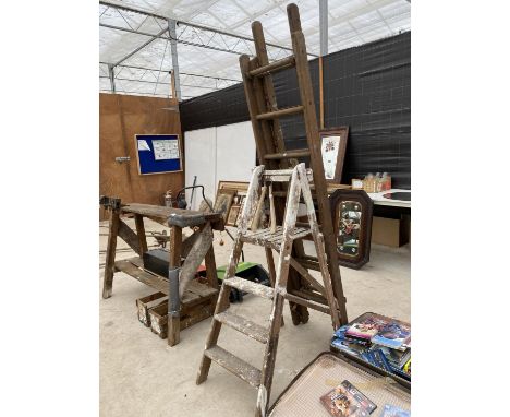 A VINTAGE THREE RUNG WOODEN STEP LADDER AND A THREE SECTION EXTENDING LADDER 