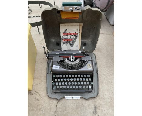 A VINTAGE CASED IMPERIAL TYPEWRITER 