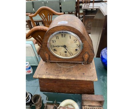 A WOODEN CASED MANTEL CLOCK WITH WOODEN PEDASTEL BASE 