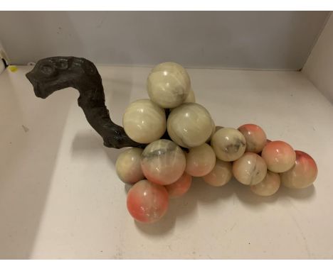 A SCULPTURE OF ONYX BALLS IN THE FORM OF A BUNCH OF GRAPES, LENGTH 36CM, HEIGHT 16CM 