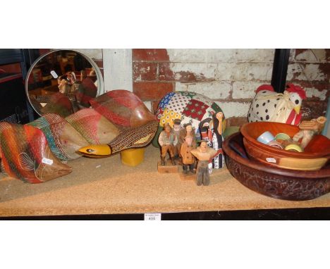 Shelf of carved and painted wooden items