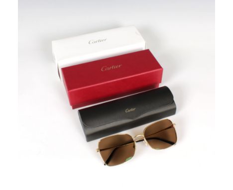  A boxed pair of Cartier gold plated Aviator sun glasses with booklet, leaflet, box, outer box and original receipt. 