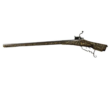  A scarce antique 17th Century Teschinke-Teschen Wheellock Rifle having slightly tapering 14mm cal. steel barrel, engraved bo