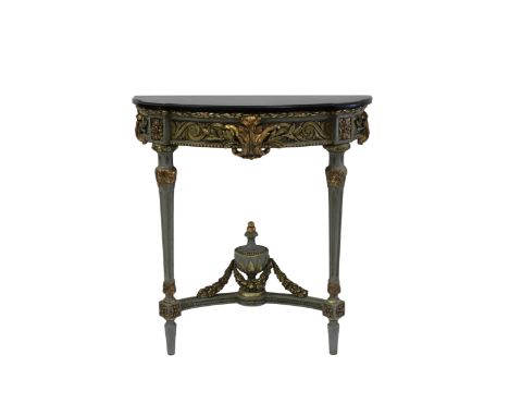  A parcel gilt demi lune console table in the Louis XVI style late nineteenth century, the black marble top over a foliate ca