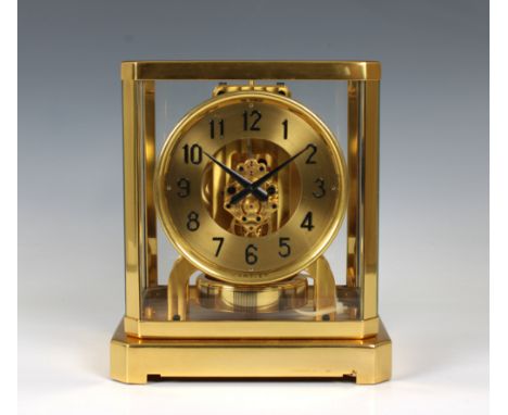  An Atmos pendulum mantel clock by Le Coultre &amp; Cie for Cartier the gilded brass case, circular dial with applied Arabic 