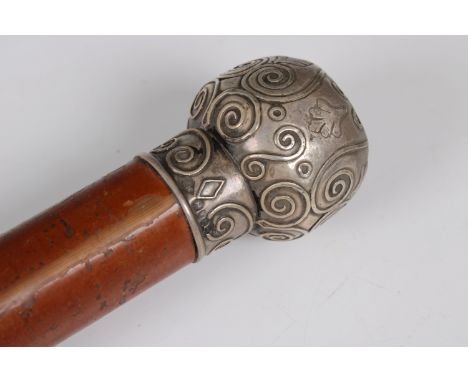 A silver topped malacca walking cane with a brass tip Henry Howell &amp; Co Ltd, London, 1894, the silver ball top with good