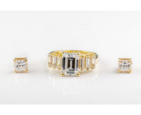  A 14ct yellow gold cubic zirconia ring centred on a step-cut cubic zirconia with baguette-cut shoulders, ring size P 1/2., t