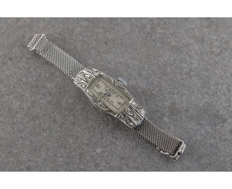  An Art Deco ladies platinum and diamond cocktail watch likely 1930s-40s with platinum bracelet strap, silvered dial and blac