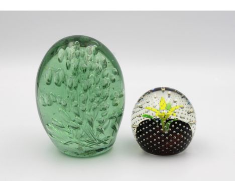 Two glass paperweights one marked "Caithness, Scotland" and "Spring", 6.5cm. high, the other a Victorian Glass Dump paperwei
