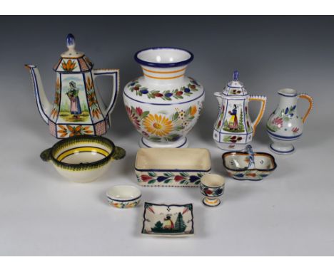  A large quantity of mostly 20th Century Quimper pottery to include a bulbous vase, a coffee pot, milk jugs, bowls, plates, e