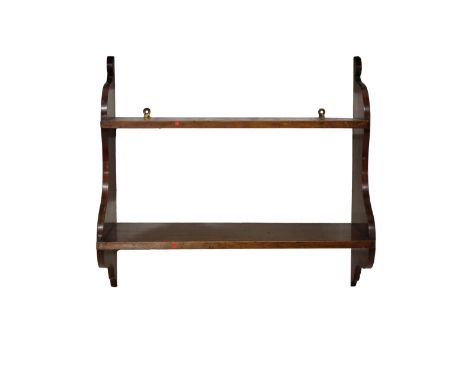  An early 19th century mahogany wall shelf comprising two shelves with shaped ends, 52.5 x 23cm. x 49cm. high. 