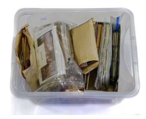 Two containers of albums and envelopes including a Great Britain collection in seven loose-leaf albums, the first book with f