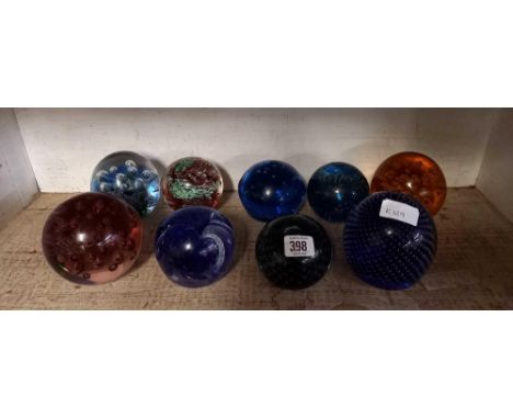 SHELF OF PAPERWEIGHTS