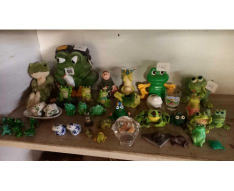 SHELF OF DISPLAY FROGS