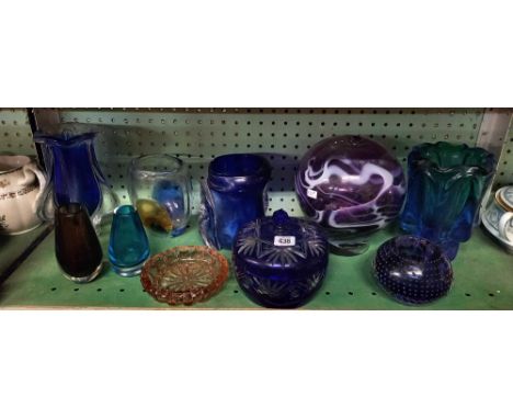 SHELF OF COLOURED GLASSWARE