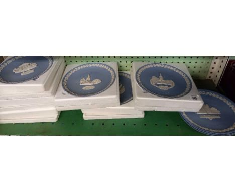 SHELF OF WEDGWOOD CHRISTMAS PLATES