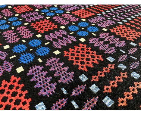 WELSH WOOLEN TAPESTRY BLANKET, CARTHEN, woven in blue, white, red and black, 188 x 232cmsProvenance: private collection Swans