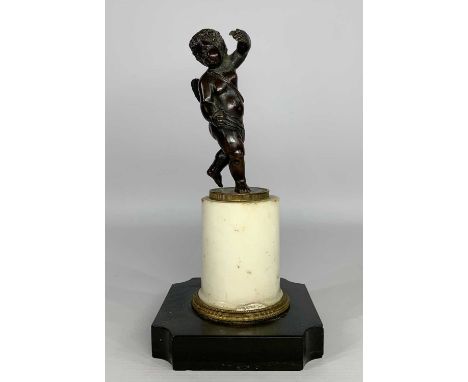 19TH CENTURY BRONZE SCULPTURE OF CUPID, half draped, on milled edge base, on marble plinth and slate base, 22.5cms hProvenanc