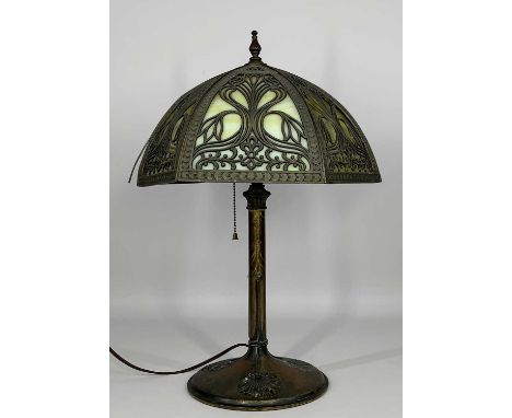 AMERICAN ART NOUVEAU TABLE LAMP, possibly by Miller, with pierced shade fitted with 6 of 6 slag glass panels, floral bud and 