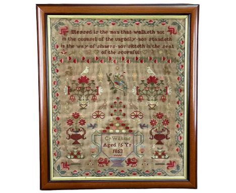 MID VICTORIAN NEEDLEWORK SAMPLER, 1853, BY C. WILKINS, AGED 16, decorated with birds, flowers, two handled cup with shrub ETC
