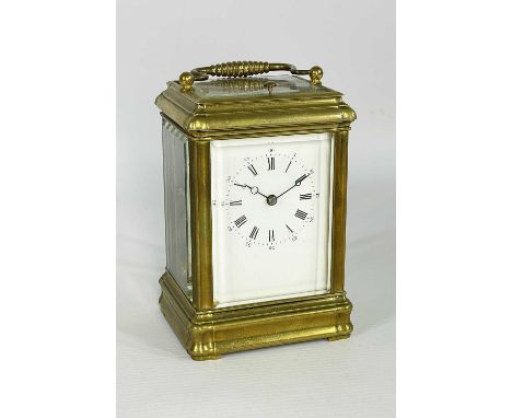 LATE 19TH CENTURY GILT BRASS REPEATING CARRIAGE CLOCK, the silvered platform stamped GV, corniche case with white enamel Roma