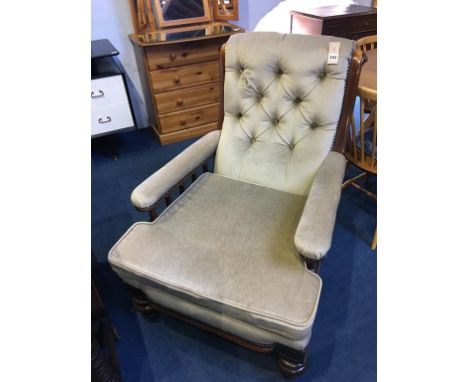 An Edwardian button back armchair