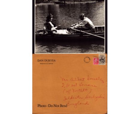 Dan Duryea signed 10x8 inch black and white vintage photo dedicated with original Hollywood mailing envelope. Good condition.