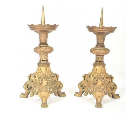 A pair of believed French 19th century brass ecclesiastic altar princkets candlesticks. Each having a sharp pricket atop with