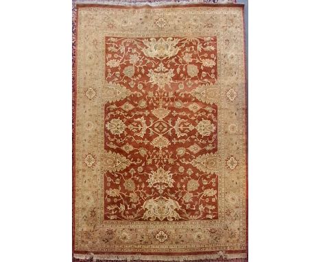 An early 20th century Persian Islamic Sarouk Mer floor carpet rug. The rug having a central red ground panel with intricately