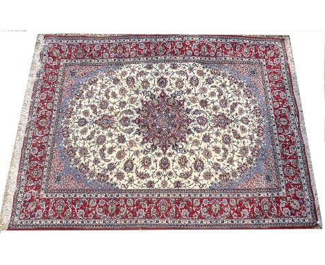 A large Iranian Persian Islamic Seirafian Isfahan hand woven signed floor carpet rug. Signed panel to one end translated to '