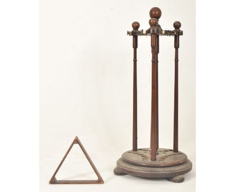 An early 20th century mahogany revolving snooker cue stand. The stand having turned spherical knobs atop over a three sided p