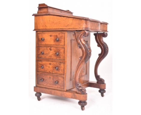 A Victorian 19th century walnut davenport writing desk. The desk having a raised desk tidy space atop with single canted draw