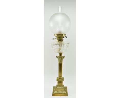 A Victorian 19th century gilt metal &amp; glass reservoir oil lamp / light. The lamp having a glass flute and frosted glass g