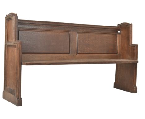 A 19th century Victorian ecclesiastical carved oak church pew / hall settle bench. The pew of typical form with carved panel 